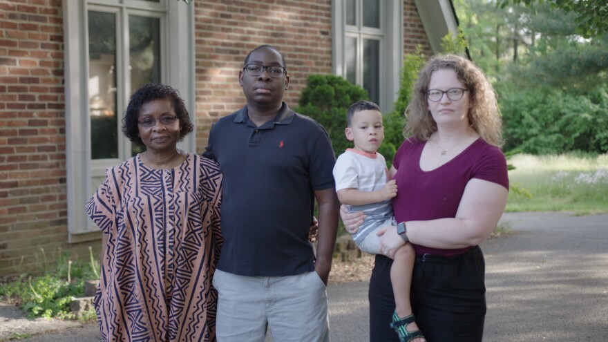 Paul Gakpo (second from the left) lives in Kentucky with his wife, Michelle (far right) and son, Louis. The family poses for a photo outside their home with Paul’s mother, Philomena, in May.