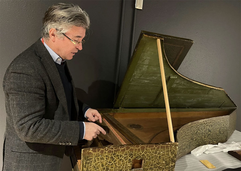 Darryl Martin examines a harpsichord during a tour at the National Music Museum. Martin moved to Vermillion from Belgium for the chance to manage one of the world’s most significant instrument collections and to lead one of the only graduate programs specializing in the history of musical instruments.