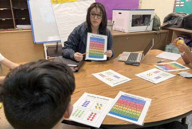 Jessica Macias works with third graders on math for one hour, three times a week at a Park Forest school. “It is not homework help,” she says of the high-impact structured tutoring. 
