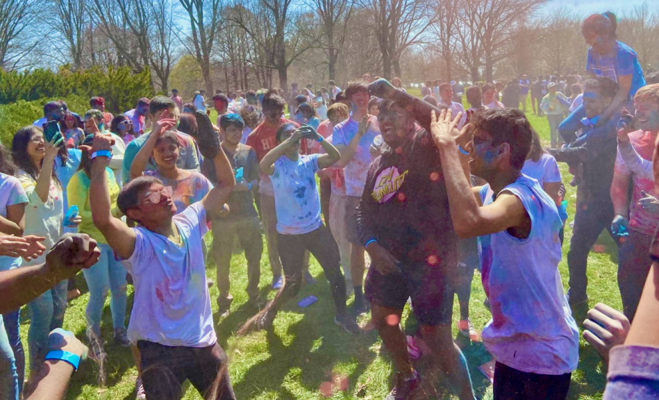 Students in field with colored dyes.