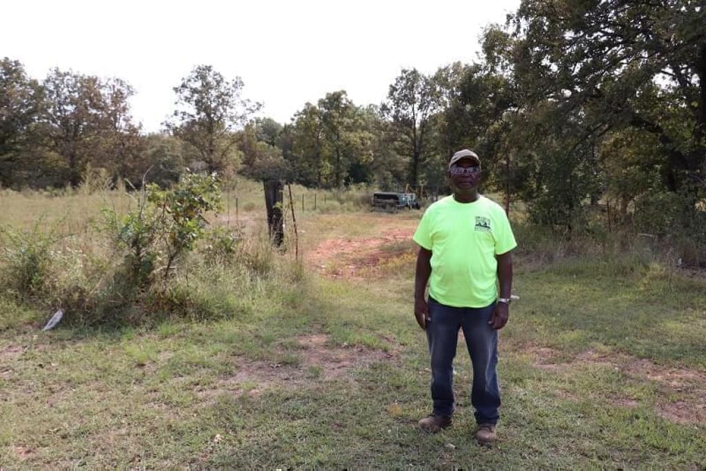 Nathan Bradford, father of Nathan Bradford Jr., stands on his land near Bristow, Oklahoma. Bradford received $50,000 as part of a class action discrimination lawsuit against the USDA. He says behind where he is standing, there used to be peanut fields.