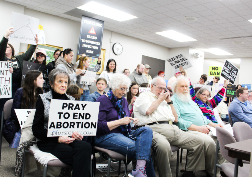 Protestors wait for the Danville City Council meeting to start on Tuesday, May 2. The council passed an ordinance outlawing the shipping of abortion medication and tools into the city. 