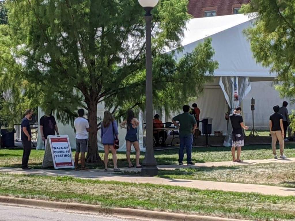 Students stand in line at a U of I testing site along Goodwin Avenue at the start of the semester in August.