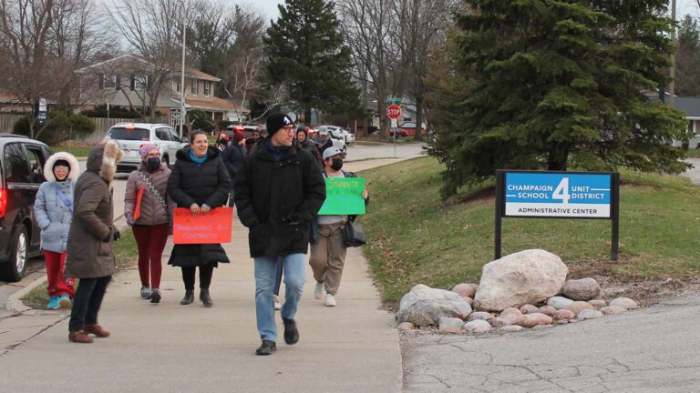 Teachers rally before the Champaign Federation of Teachers and Unit 4 Board of Education began a negotiating session that resulted in a contract agreement on March 29, 2022.