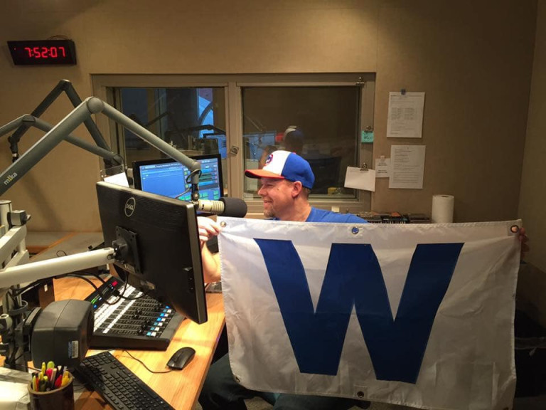 Illinois Public Media's Brian Moline celebrates in the WILL studio after the Chicago Cubs won the World Series in 2016. 
