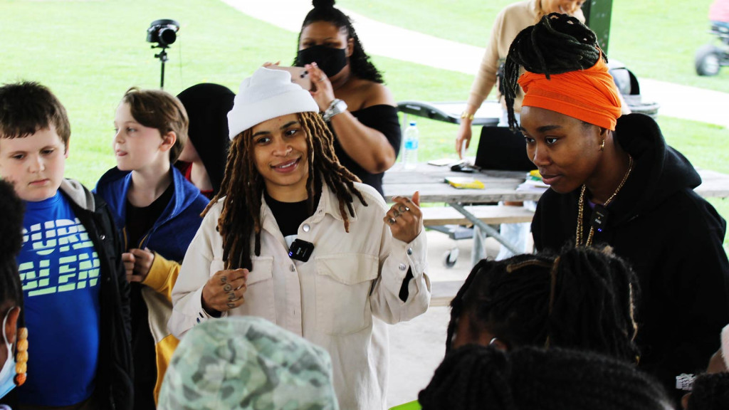 Hip hop duo Mother Nature visit Booker T. Washington STEM Academy in late April 2022.