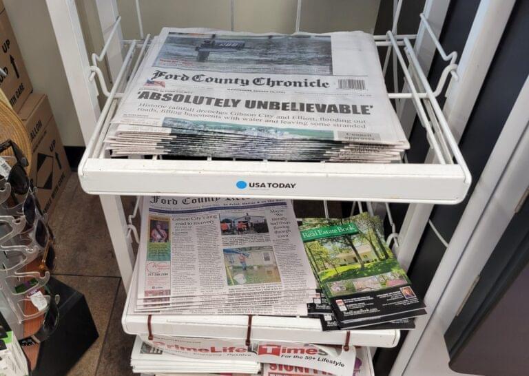 In August, a newspaper rack at the Casey's convenience store in downtown Paxton displayed copies of Ford County's two competing newspapers, the Record and the Chronicle.