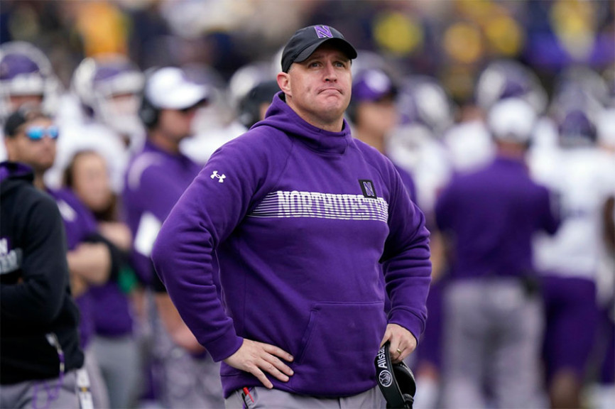 Northwestern head coach Pat Fitzgerald stands on the sideline during the first half of an NCAA college football game against Michigan in 2021. Northwestern fired Fitzgerald on Monday amid hazing allegations.