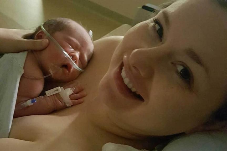  Paige Raab holds her baby in the neonatal intensive care unit. Her experience with two traumatic births and NICU stays led her to create the new nonprofit group, 