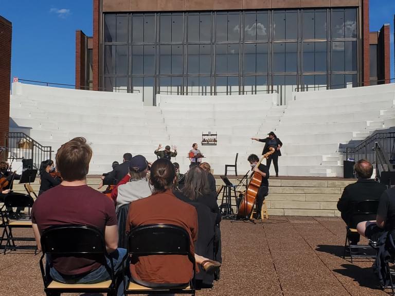 A socially distanced audience watches the Lyric Theatre department’s production of “The Last American Hammer” in the Krannert Center’s amphitheater. The show combined bluegrass music and opera for a story about a conspiracy theorist and a dying community in rural Ohio.