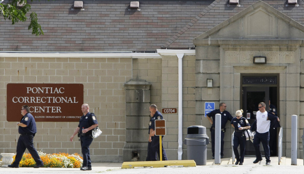  In this Aug. 20, 2008 file photo, corrections officers leave the Pontiac Correctional Center during a shift change in Pontiac, Ill. 