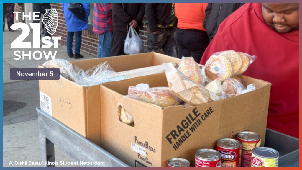 Patrons wait to receive non-perishable goods from the Daily Bread Soup Kitchen in Champaign Friday, Oct. 31.