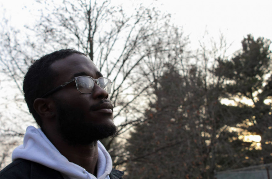 Shamar Betts, 23, walks in a park in Urbana near his home. After a difficult past, he says he’s working toward his goal of becoming a guidance counselor and mentor for children.