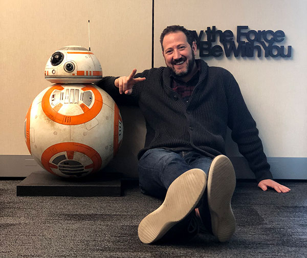 Alumnus Stephen Feder with BB-8 in the Lucasfilm Offices at the Walt Disney Studios.
