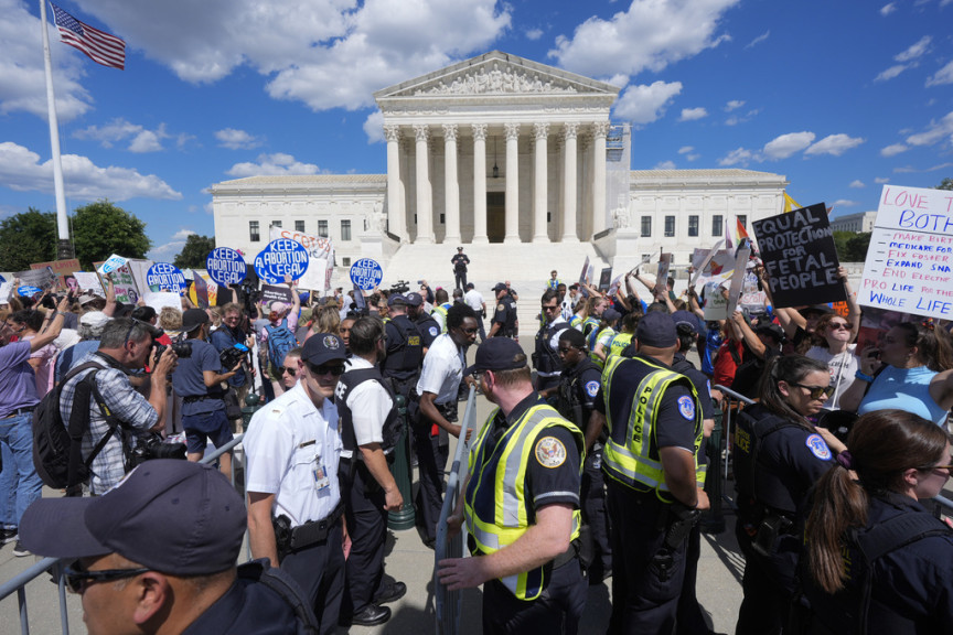 You can use this for the 2 years since Dobbs segment. U.S. Supreme Court Police officers and U.S. Capitol Police officers place barriers between anti-abortion and abortion-rights demonstrators outside the Supreme Court, Monday, June 24, 2024, in Washington.