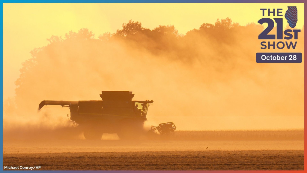 a huge cloud of dust turns the skies orange as a John Deere implement harvests soybeans