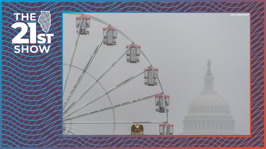 the ferris wheel has 24 passenger cars, each of which is framed in white and red lights; fog obscures the dome of the Capitol Building, which is still visible in the background; in the foreground you can see the golden eagle atop a mock version of the 