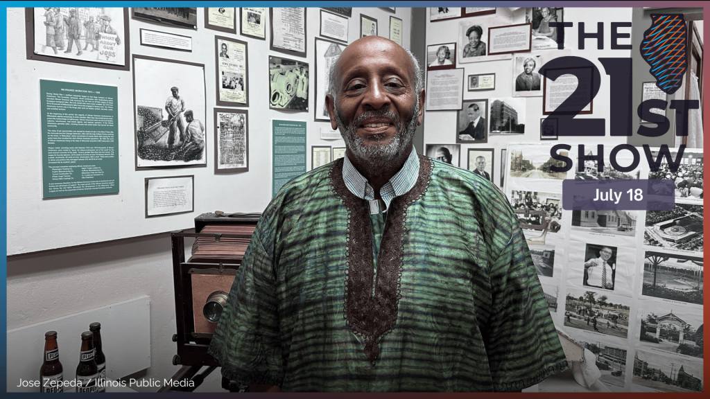 Clayborn Benson is the Director and Founder of  the Wisconsin Black Historical Society and Museum. He stands behind some of the displays in the museum.