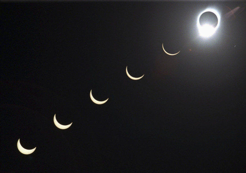 The progression of a total solar eclipse is seen in a multiple exposure photograph taken in 5-minute intervals, with the moon passing in front of the sun above Siem Reap in northwestern Cambodia, 225 kilometers (140 miles) from Phnom Penh, on Tuesday, Oct. 24, 1995.