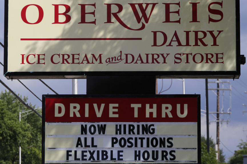 A hiring sign is seen outside of an Oberweis ice cream and dairy store in Rolling Meadows, Ill., Wednesday, July 29, 2020.