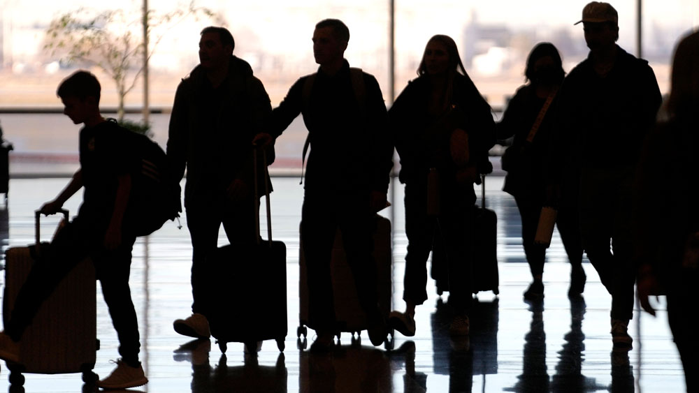 People pass through Salt Lake City International Airport on Jan. 11, 2023, in Salt Lake City. 