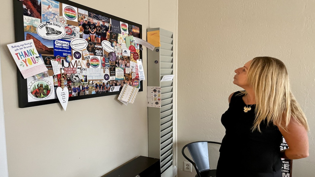 Charmin Gabbard looks at a bulletin board in her office at Connection Cafe — the Indiana Recovery Network regional recovery hub she runs in Connersville, Indiana. After she was released from prison in 2015, Gabbard did not have a driver’s license. She said transportation is a huge barrier for many with a history of substance use.