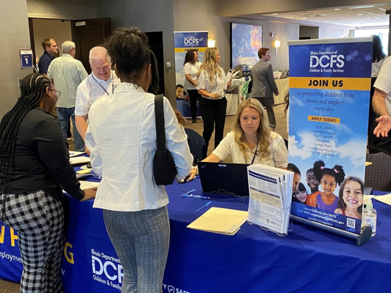 The Illinois Department of Children and Family Services looked to fill at least 50 child welfare and case investigator positions on Monday during an on-the-spot job fair in Bloomington.