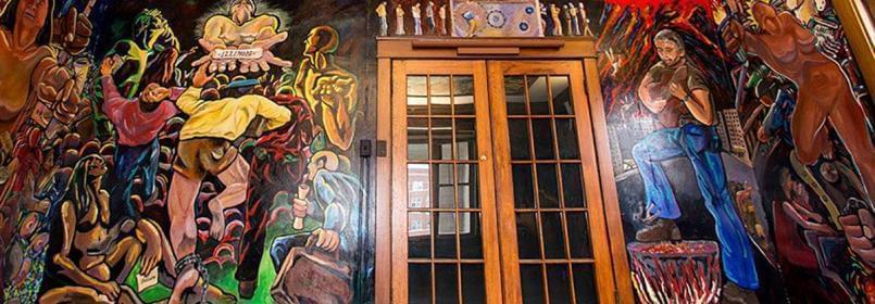 Murals at La Casa Cultural Latina, one university resource for undocumented students. 