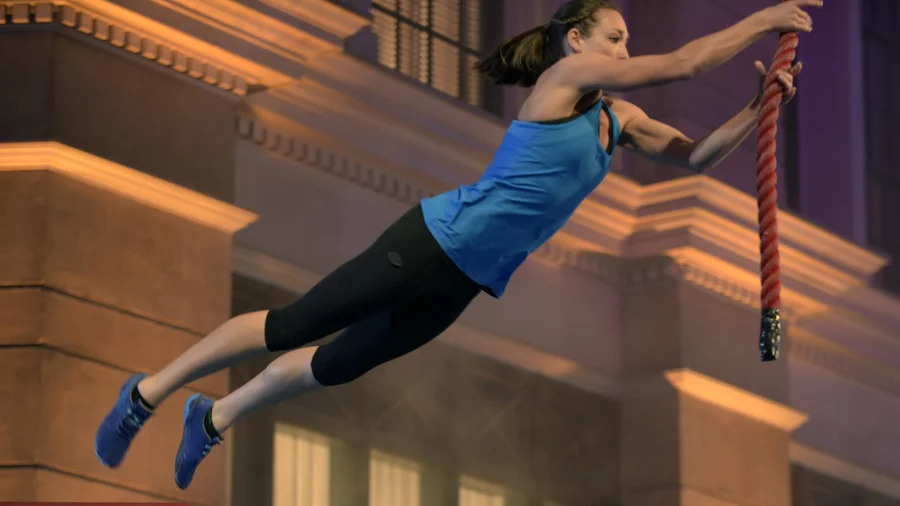 Intelligence officer Tory Garcia, who has a background in gymnastics and diving, works through the obstacle course on American Ninja Warrior, which airs on NBC and Esquire Network.