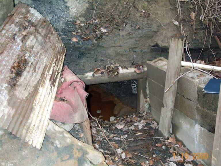 A photo of a portal, or an unsealed entrance to a mine tunnel.