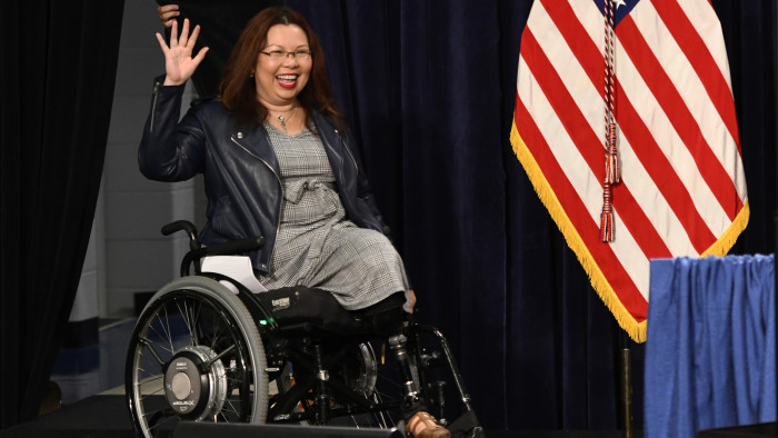 Sen. Tammy Duckworth, D-Ill., waves to supporters during a rally in Joliet, Ill., on Saturday, Nov. 5, 2022, ahead of Tuesday’s midterm elections.