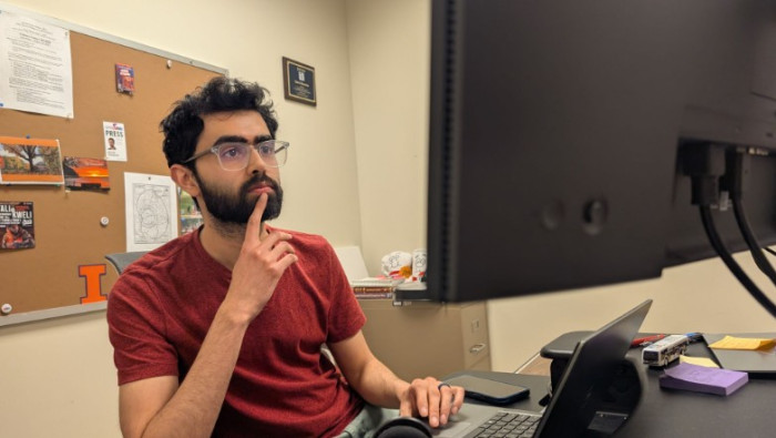 man sitting at computer