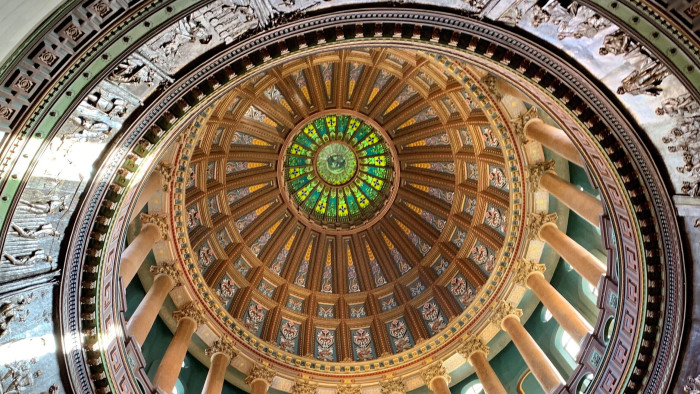 The top of the Illinois State Capitol Rotunda has a stained glass representation of the State Seal with 9,000 pieces of glass.