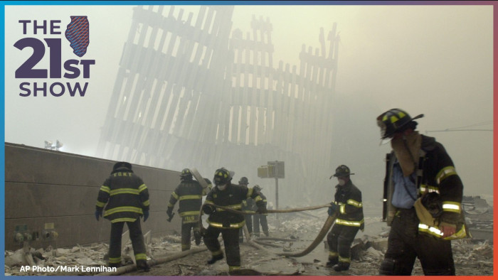 FILE - In this Sept. 11, 2001 file photo, firefighters work beneath the destroyed mullions, the vertical struts which once faced the soaring outer walls of the World Trade Center towers, after a terrorist attack on the twin towers in New York. Families of the victims of the worst terror attack on the United States in history gathered Wednesday, Sept. 11, 2013, to mark their 12th anniversary with a moment of silence and the reading of names. The Sept. 11, 2001 attacks in New York City and Washington killed almost 3,000 people and lead to a war in Afghanistan.