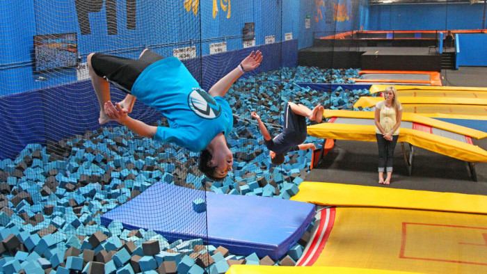 In this July 31, 2013, file photo, a patron flips at a trampoline park in Orem, Utah. Trampoline park injuries have soared as the indoor jumping trend has spread. That's according to a study published Monday, Aug. 1, 2016, that shows annual U.S. emergency room visits jumped 12-fold for park-related injuries from 2010 through 2014.