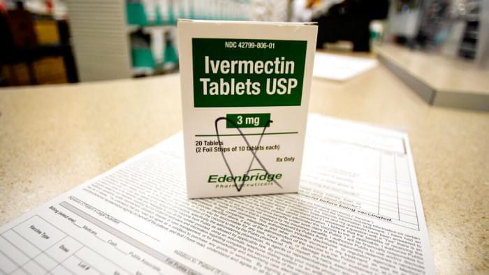A box of ivermectin is shown in a pharmacy as pharmacists work in the background, Thursday, Sept. 9, 2021, in Ga. At least two dozen lawsuits have been filed around the U.S., many in recent weeks by people seeking to force hospitals to give their COVID-stricken loved ones ivermectin, a drug for parasites that has been promoted by conservative commentators as a treatment despite a lack of conclusive evidence that it helps people with the virus. 