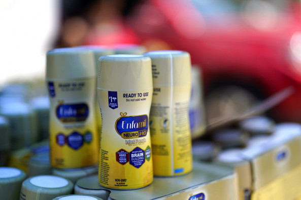 Infant formula is stacked on a table during a baby formula drive to help with the shortage Saturday, May 14, 2022, in Houston. 