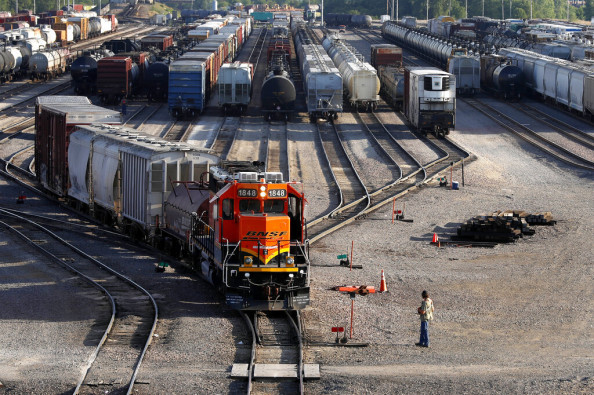 A BNSF rail terminal worker monitors the departure of a freight train, on June 15, 2021, in Galesburg, Ill. The special board appointed by President Joe Biden to intervene in the stalled railroad contract talks submitted its recommendations to the White House, Tuesday, Aug. 16, 2022, on how to settle the deal that covers 115,000 rail workers and avert a strike, but the details of what those arbitrators suggested weren't immediately available.
