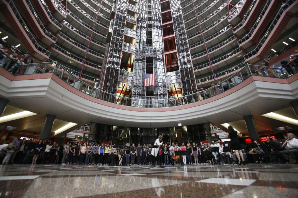 In this March 19, 2013 file photo, soprano Renee Fleming performs with world-famous cellist Yo-Yo Ma and a choir of dozens of high school students in the rotunda of the James R. Thompson Center in Chicago.