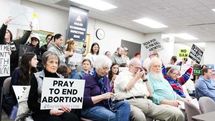 Protestors wait for the Danville City Council meeting to start on Tuesday, May 2.