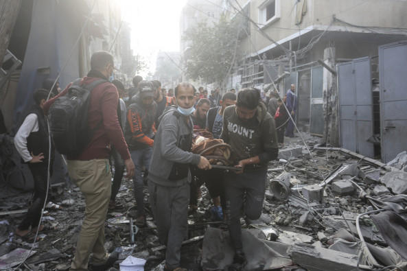 Palestinians evacuate wounded in Israeli bombardment Rafah, Gaza Strip, Friday, Dec. 1, 2023.