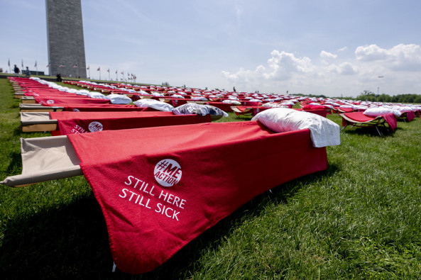 Advocates for people suffering from long COVID-19 and myalgic encephalomyelitis/chronic fatigue syndrome host an installation of 300 cots in front of the Washington Monument on the National Mall in Washington, Friday, May 12, 2023, to represent the millions of people suffering from post-infectious disease. 