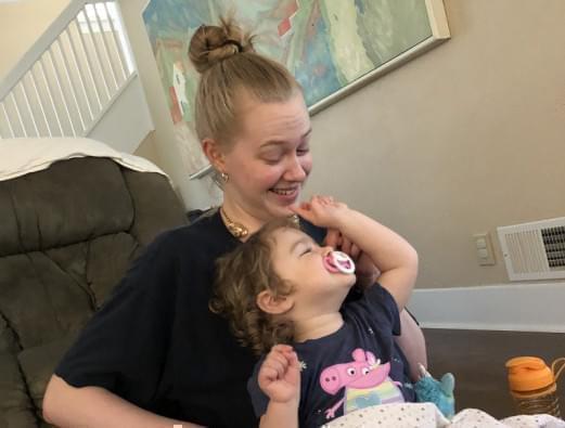 Shaersti Anderson and her daughter Raelynn bond after Anderson picks Raelynn up from daycare. Anderson said that balancing taking care of Raelynn and doing her school work has not been easy, especially since the transition to online classes.