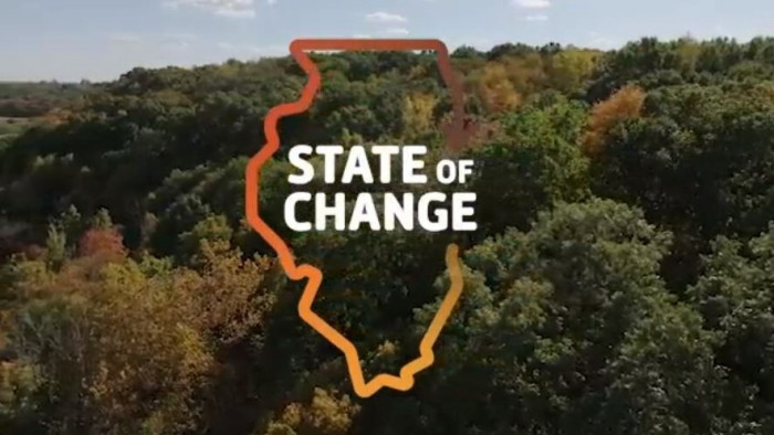 State of change logo over tree tops