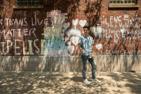 Iggy Ladden, a co-founder of Chicago Therapy Collective, stands in front of a mural in Andersonville honoring Elise Malary, a transgender activist who went missing and was found dead in Lake Michigan last year.