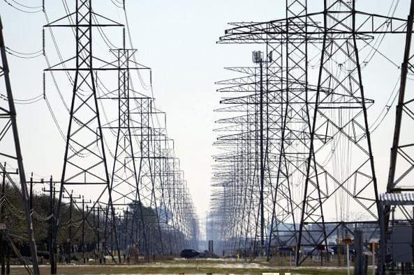 Shown above are power lines in Houston. A Democratic senator is calling for federal investigations into possible price gouging of natural gas in the Midwest and other regions following severe winter storms that plunged Texas and other states into a deep freeze that caused power outages in million of homes and businesses.