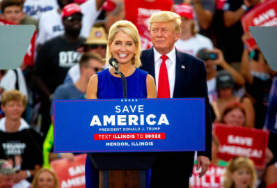 Illinois U.S. Rep. Mary Miller (R-Oakland) speaks next to former President Donald Trump, who endorsed Miller for Illinois’ 15th Congressional District, on Saturday, June 25, 2022, during a “Save America!” Rally at the Adams County Fairgrounds in Mendon, Ill. Miller defeated fellow incumbent Rodney Davis in the 15th District Republican Primary.