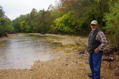 Missouri Farmer Chris Brundick stands near a low lying area on his Maries County farm he is concerned could be classified as a "Water of the United States" and put more restrictions on his ability to farm. 