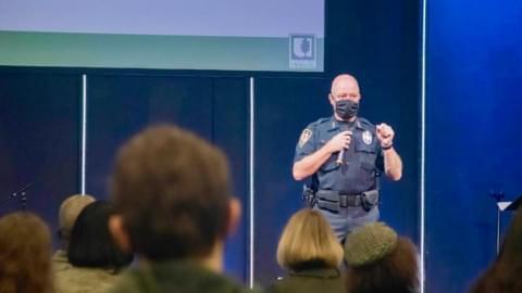Photo of Urbana police chief speaking with microphone