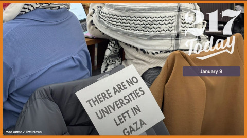 University of Illinois students protest and hold a study in at Grainger Library. Some students wore Kuffiyehs and put up posters on laptops and chairs.